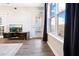 Bright living room featuring hardwood floors, modern media center, and large windows with cityscape views at 390 17Th Nw St # 5031, Atlanta, GA 30363