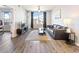Bright living room featuring hardwood floors and a large window with city views at 390 17Th Nw St # 5031, Atlanta, GA 30363