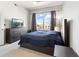 Serene main bedroom with a large window, allowing natural light to filter into the room at 390 17Th Nw St # 5031, Atlanta, GA 30363