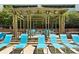 Community pool featuring lounge chairs and a shaded seating area at 390 17Th Nw St # 5031, Atlanta, GA 30363