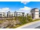 Scenic view of modern buildings, green trees, and clear blue sky, offering a calming experience at 390 17Th Nw St # 5031, Atlanta, GA 30363