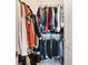 Walk-in closet featuring wire shelving filled with hanging clothes and shoes at 390 17Th Nw St # 5031, Atlanta, GA 30363