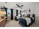 Bedroom with two twin beds, dark trim, carpet, and ceiling fan at 1629 Tide Mill Rd, Cumming, GA 30040