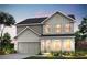Charming two-story home with an attached two-car garage and beautifully manicured landscaping at 1629 Tide Mill Rd, Cumming, GA 30040