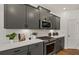 Stylish kitchen featuring modern appliances, quartz countertops, and custom cabinetry at 1629 Tide Mill Rd, Cumming, GA 30040