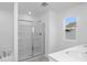 Bathroom with a glass-doored shower and tub, plus a white sink vanity at 213 Groveton Ct, Euharlee, GA 30145