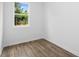 Bedroom with bright window and wood flooring at 213 Groveton Ct, Euharlee, GA 30145