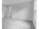 Bright bedroom features neutral carpeting and a doorway leading to the en suite at 213 Groveton Ct, Euharlee, GA 30145