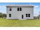 Rear exterior of home with white siding and lawn at 213 Groveton Ct, Euharlee, GA 30145