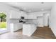 Bright, open kitchen featuring stainless steel appliances, granite countertops and hardwood floors at 213 Groveton Ct, Euharlee, GA 30145