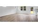 An open living room featuring hardwood floors, stairs and lots of natural light at 213 Groveton Ct, Euharlee, GA 30145