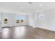 Bright living room features hardwood floors, recessed lighting, and large windows at 213 Groveton Ct, Euharlee, GA 30145