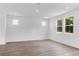 Spacious living room with recessed lights and multiple windows allowing ample natural light at 213 Groveton Ct, Euharlee, GA 30145
