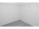 A walk-in closet is carpeted and has wire shelving for storage at 213 Groveton Ct, Euharlee, GA 30145