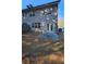Backyard view features a small patio, privacy fence, and a grassy area at 3285 Wild Basil Ln, Buford, GA 30519
