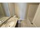 Bright bathroom features a tub, granite countertop vanity, and toilet at 3285 Wild Basil Ln, Buford, GA 30519