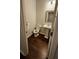 Charming bathroom features toilet, pedestal sink, and dark hardwood flooring at 3285 Wild Basil Ln, Buford, GA 30519
