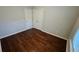 Bedroom with hardwood floors and double door closet at 3285 Wild Basil Ln, Buford, GA 30519
