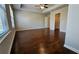 Spacious bedroom featuring hardwood floors, a ceiling fan, and a walk-in closet at 3285 Wild Basil Ln, Buford, GA 30519