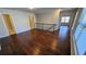 Upstairs bonus room featuring hardwood floors and natural light through the window at 3285 Wild Basil Ln, Buford, GA 30519