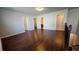 Open bonus room with multiple entryways and hardwood flooring at 3285 Wild Basil Ln, Buford, GA 30519