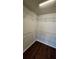 Walk-in closet featuring hardwood floors and white wire shelving at 3285 Wild Basil Ln, Buford, GA 30519