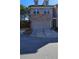 Front exterior of the home showing the garage, brick accents, driveway and easy-care landscaping at 3285 Wild Basil Ln, Buford, GA 30519