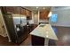 Well-appointed kitchen showcasing granite counters, an island, and stainless steel appliances at 3285 Wild Basil Ln, Buford, GA 30519