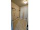 A simple laundry room features a shelf, hookups, and ceramic tile at 3285 Wild Basil Ln, Buford, GA 30519