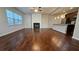 Hardwood floors and open concept floorplan combine to make this space ideal for entertaining at 3285 Wild Basil Ln, Buford, GA 30519