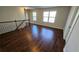 Living room with hardwood floors and staircase at 3285 Wild Basil Ln, Buford, GA 30519