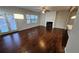 Spacious living room boasting hardwood floors, a fireplace, and an open floorplan at 3285 Wild Basil Ln, Buford, GA 30519