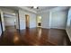 Spacious main bedroom with hardwood floors, two windows, and multiple closets at 3285 Wild Basil Ln, Buford, GA 30519