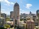 Stunning aerial view of the cityscape featuring modern buildings against a bright blue sky at 75 14Th Ne St # 3830, Atlanta, GA 30309
