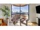 Balcony view of the city skyline, showcasing seating, plants, and flowers at 75 14Th Ne St # 3830, Atlanta, GA 30309