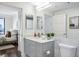 Bathroom vanity with marble countertops, with view to a bedroom and city skyline at 75 14Th Ne St # 3830, Atlanta, GA 30309