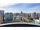 Expansive city views from this high-rise apartment, showcasing an urban landscape with a bright sky above at 75 14Th Ne St # 3830, Atlanta, GA 30309