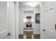 Hallway view into the white kitchen with stainless steel appliances and marble backsplash at 75 14Th Ne St # 3830, Atlanta, GA 30309