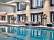 Inviting indoor pool area with elegant seating, large windows, and a tranquil atmosphere at 75 14Th Ne St # 3830, Atlanta, GA 30309