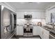 Modern kitchen featuring stainless steel appliances, white cabinets, and stunning marble countertops at 75 14Th Ne St # 3830, Atlanta, GA 30309