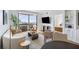 Elegant living room with floor-to-ceiling windows offering expansive city views and an open-concept layout at 75 14Th Ne St # 3830, Atlanta, GA 30309