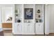 Elegant view of the living room built-in cabinets and shelves leading to the main bedroom at 75 14Th Ne St # 3830, Atlanta, GA 30309