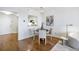Open-concept living area with hardwood floors, dining area with modern lighting, and a view of the kitchen at 75 14Th Ne St # 3830, Atlanta, GA 30309