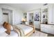 Cozy bedroom with built-in shelving, a work area, and a glimpse into the dining area at 75 14Th Ne St # 3830, Atlanta, GA 30309