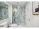 Modern bathroom shower with marble tiling and glass door at 75 14Th Ne St # 3830, Atlanta, GA 30309