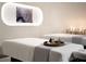 Serene spa room featuring massage tables, ambient lighting, and decorative art for a relaxing experience at 75 14Th Ne St # 3830, Atlanta, GA 30309