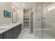 Modern bathroom features double vanity, tile floors, and a glass shower with bench for comfortable bathing at 103 Birch St, Decatur, GA 30030
