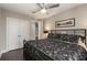 Comfortable bedroom featuring a ceiling fan, hardwood floors, and ample closet space at 103 Birch St, Decatur, GA 30030
