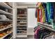 Spacious walk-in closet with custom shelving and ample storage for shoes, hats, and hanging clothes at 103 Birch St, Decatur, GA 30030