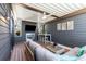 Cozy covered patio offers a seating area with a fireplace and mounted TV for outdoor entertainment at 103 Birch St, Decatur, GA 30030